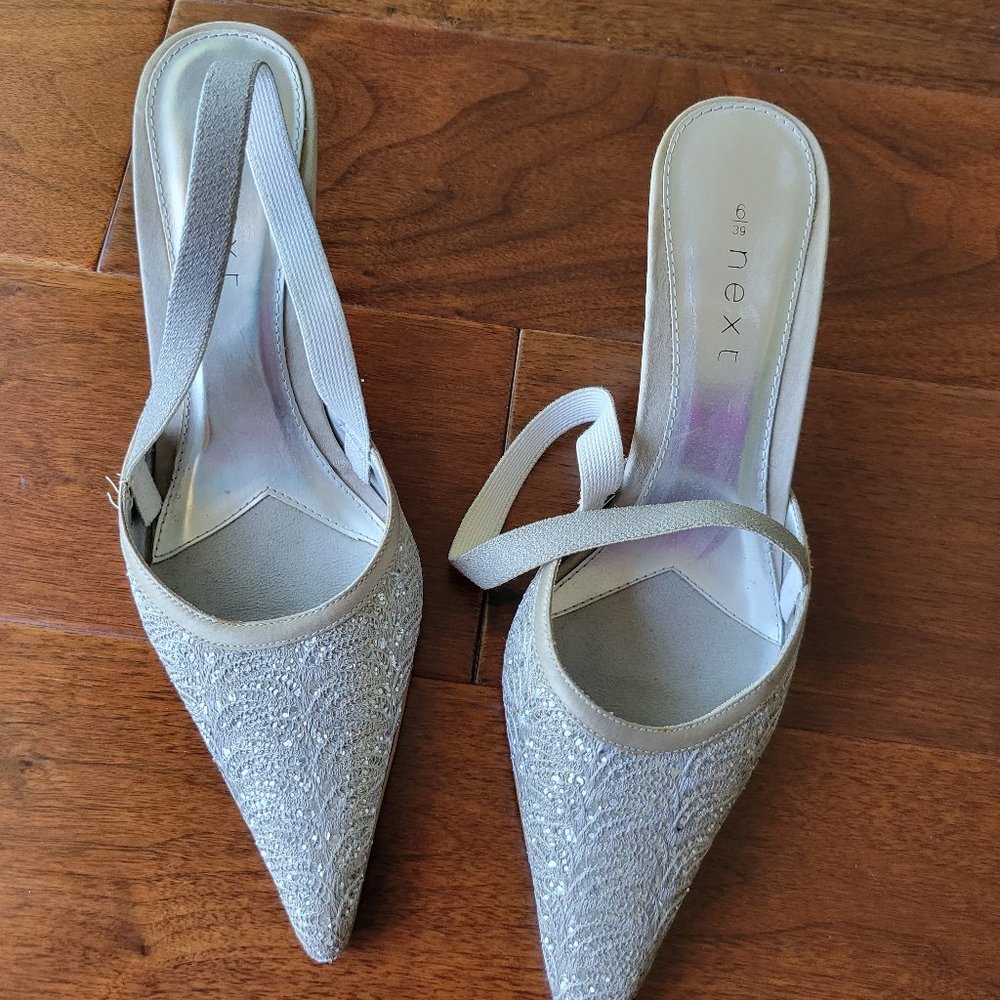 Cream pointed toe sling back